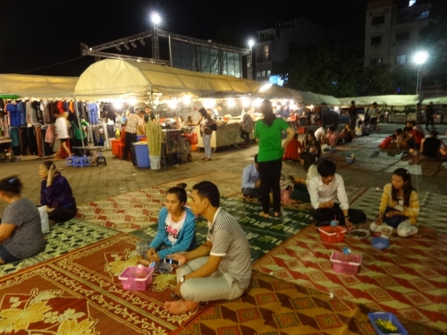 Nice vibe at the night market, with people just spreading out on the floor eating their food. 